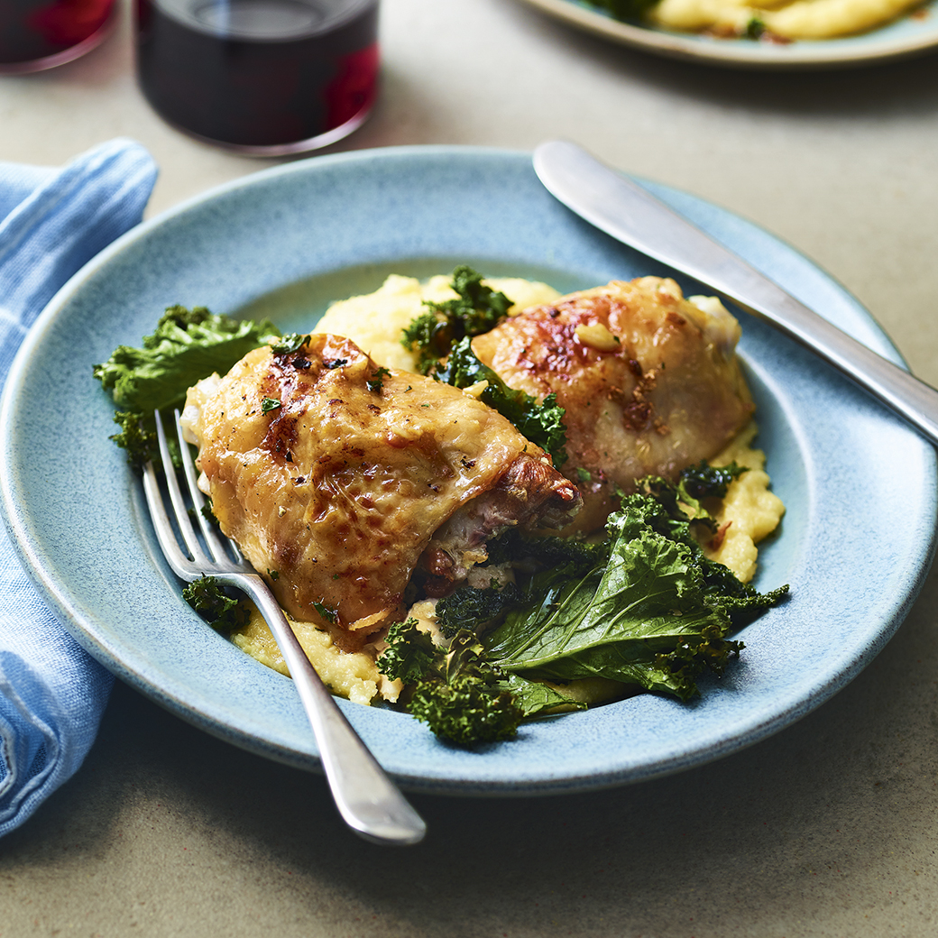 Garlic Chicken Thighs with Cacio e Pepe Polenta and Crispy Kale