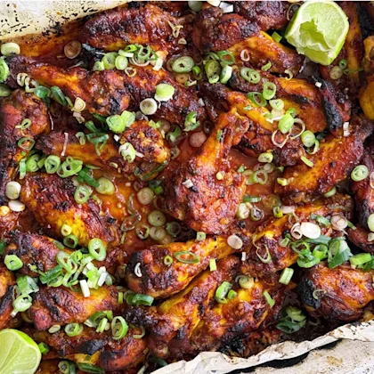 Ottolenghi’s Sweet and Smokey Chicken Wings with Spring Onions and Lime