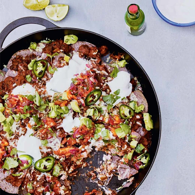 Refried beans with tortilla chips, chopped salad and burnt salsa
