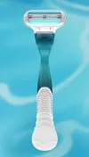 360 video of a dark blue razor with an oval 3 bladed razor head
