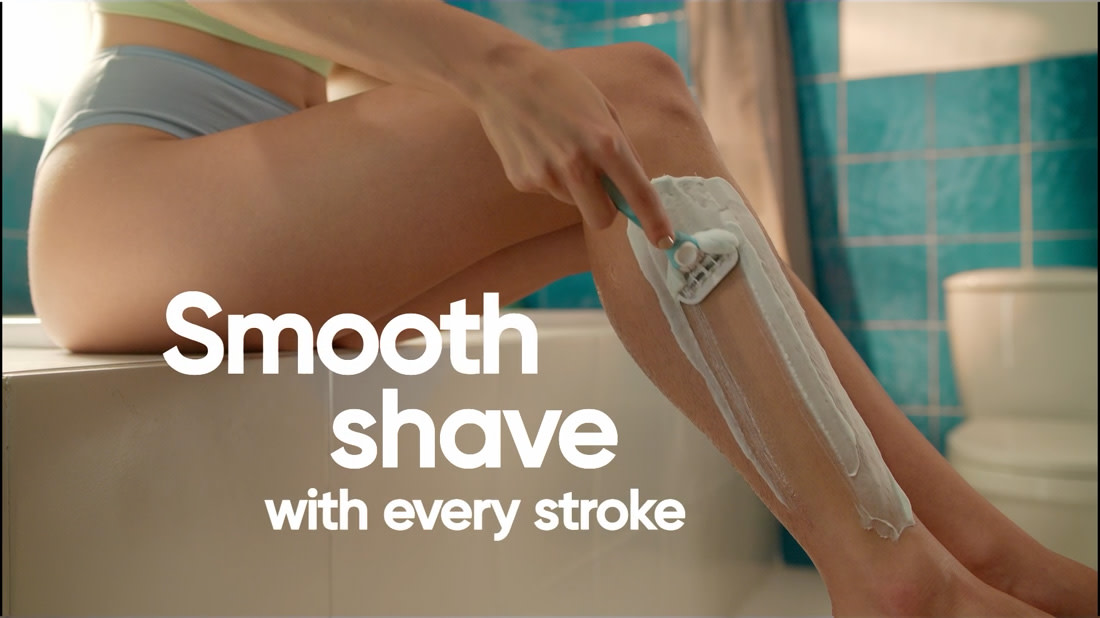 Gillette Venus Extra Smooth razor video showing woman shaving her left leg, with copy: Smooth shave with every stroke