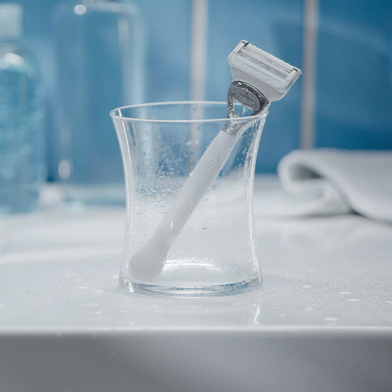 Gillette Venus Pubic razor placed in the glass