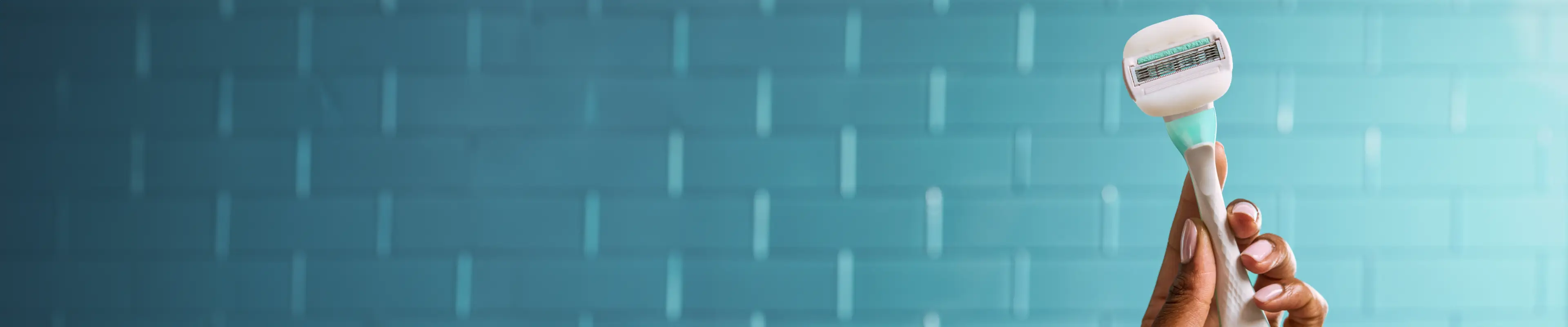 Young woman rubbing shaving cream under her arm