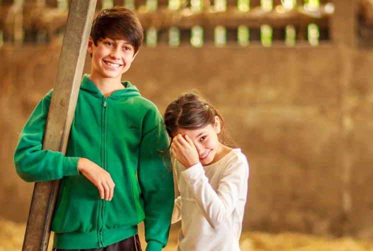 Kids enjoying themselves on the farm.