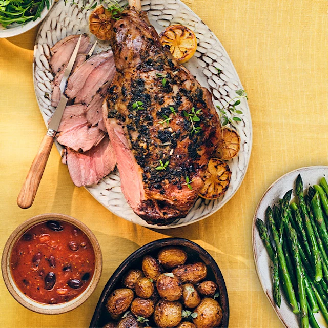 Greek-Style Roast Lamb & New Potatoes with Tomato & Olive Sauce