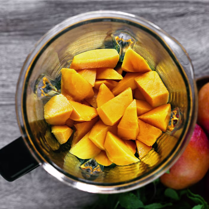 chopped mango in blender