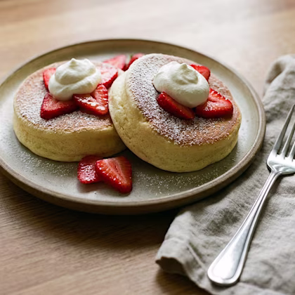 Japanese Soufflé Cloud Pancakes with cream and strawberries