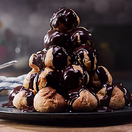 Profiterole Tower with Vanilla Cream & Chocolate Sauce