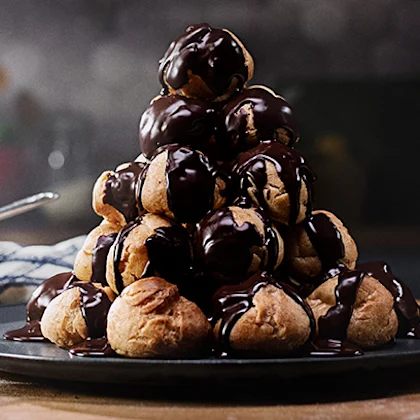 Profiterole Tower with Vanilla Cream & Chocolate Sauce