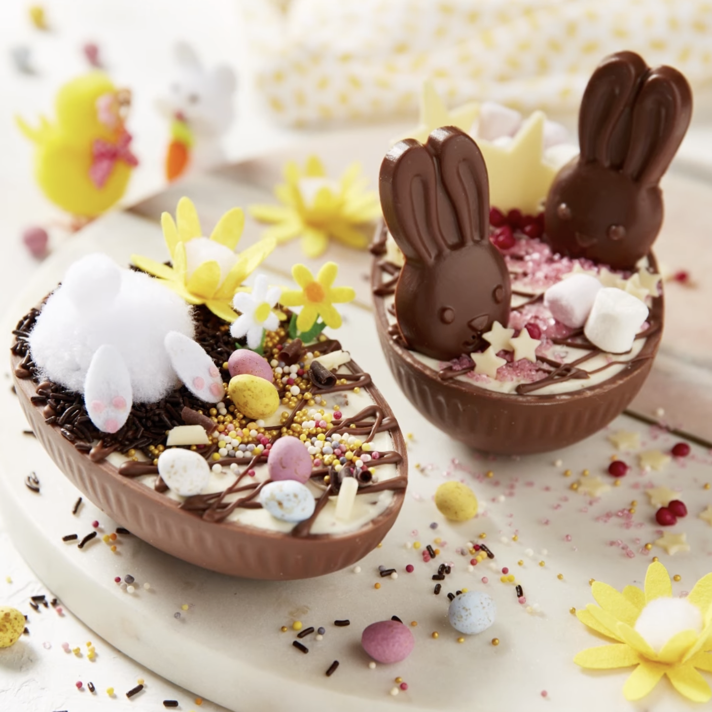 halved milk chocolate egg filled with cheesecake and decorated