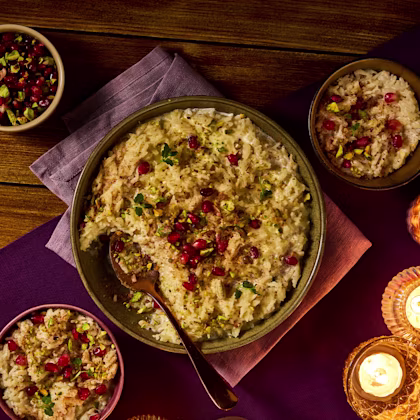 rice pudding with pomegranate and pistachio garnish