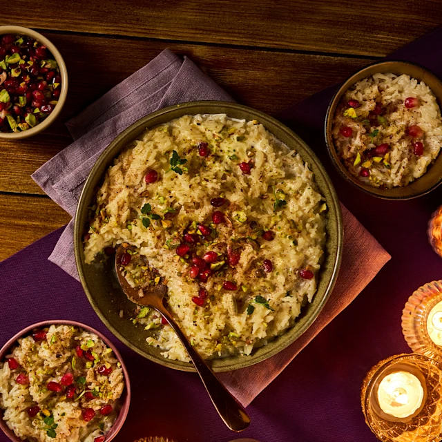 rice pudding with pomegranate and pistachio garnish