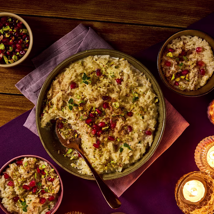 rice pudding with pomegranate and pistachio garnish