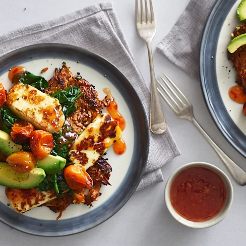Sweet potato rosti stack with roasted tomatoes, halloumi, avocado and sweet chilli sauce
