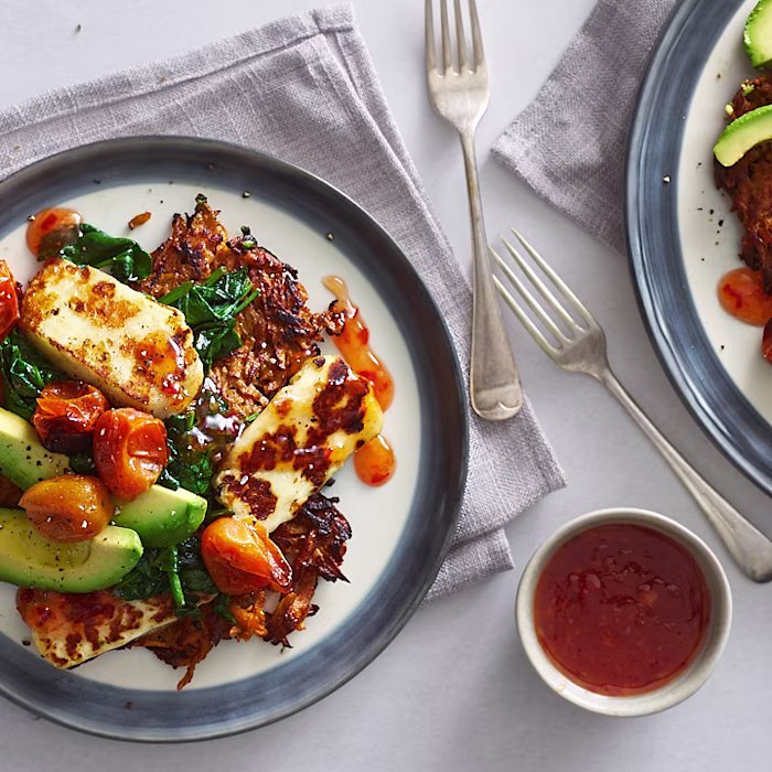 Sweet potato rosti stack with roasted tomatoes, halloumi, avocado and sweet chilli sauce
