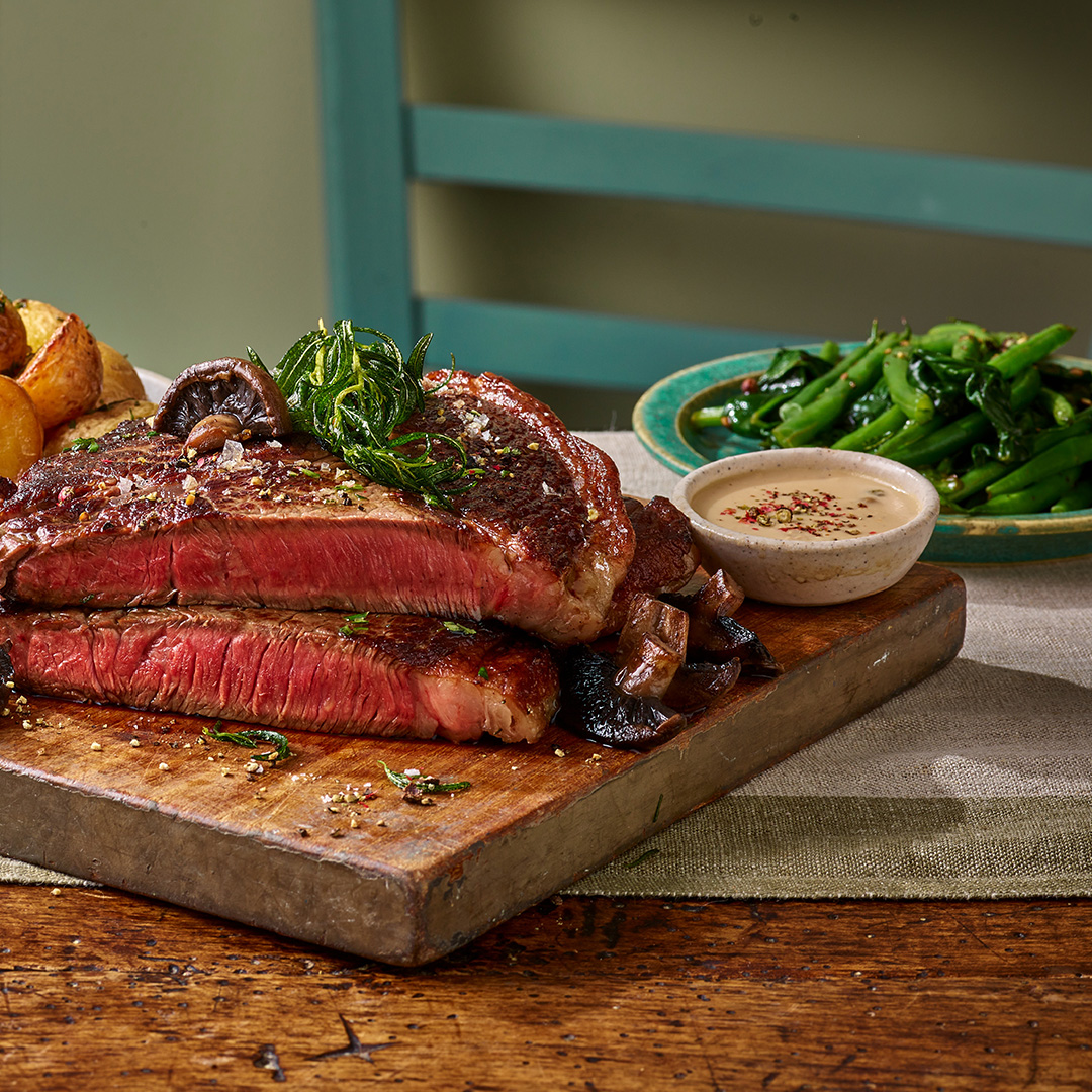 medium rare steak with garlic pan fried beans