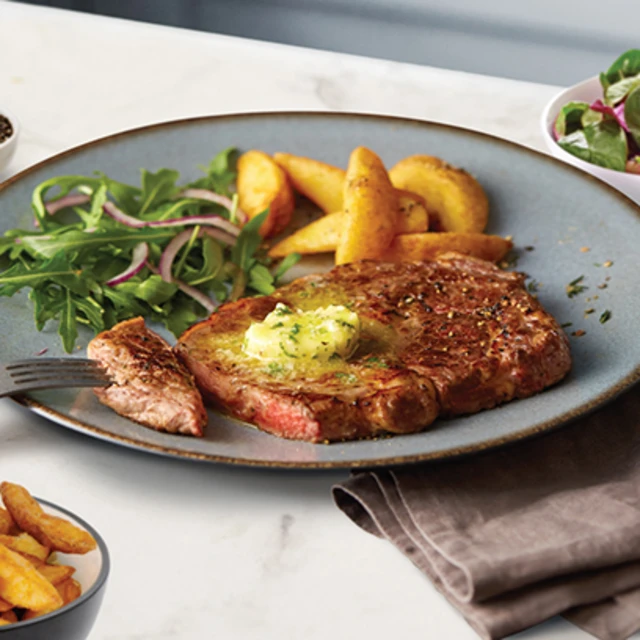 A Perfect Ribeye Steak with Horseradish, Garlic & Parsley Butter