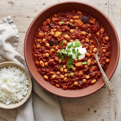 bowl of chilli with a side bowl of rice