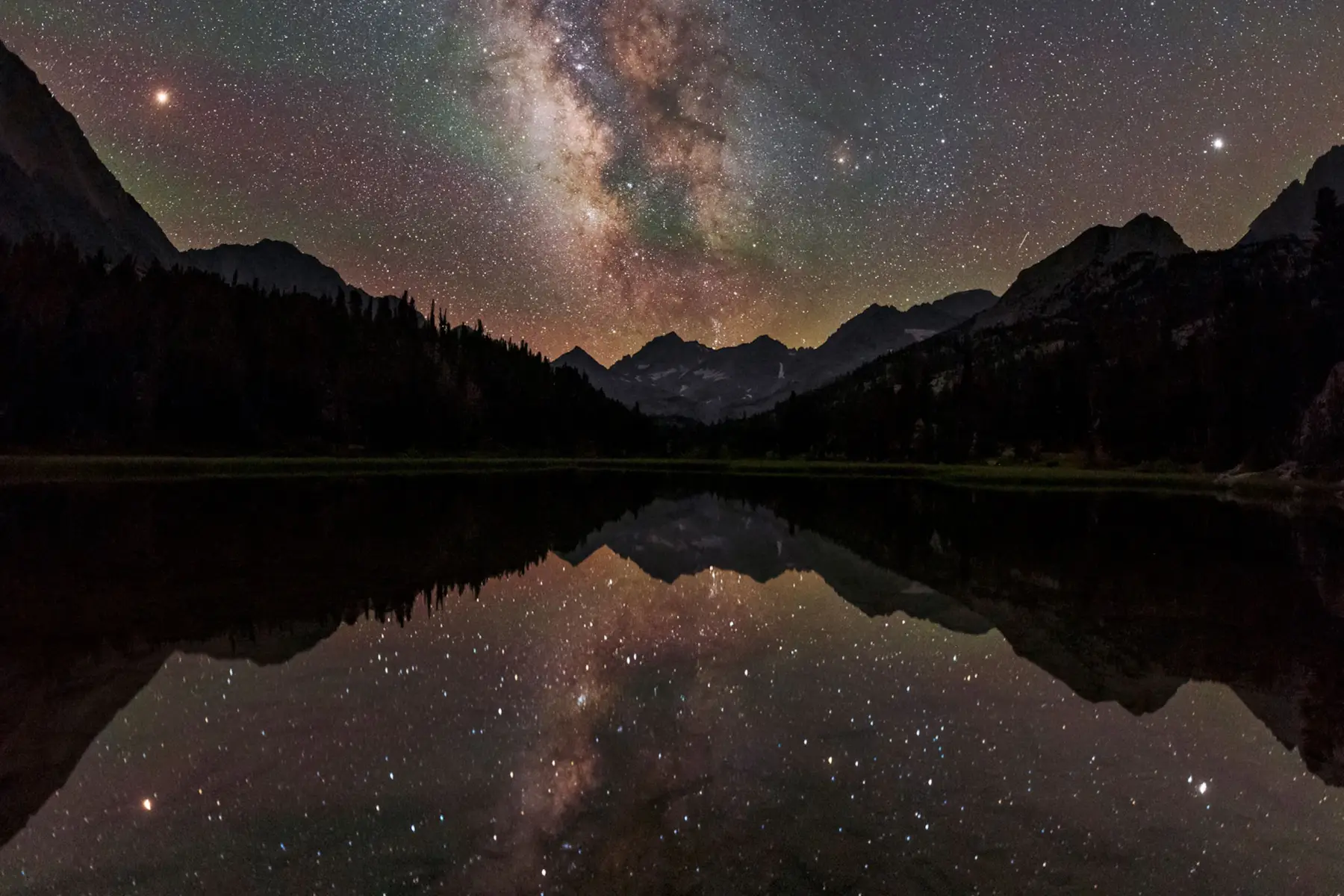 The Milky Way Arcs over Mountain Lake by Babak Tafreshi