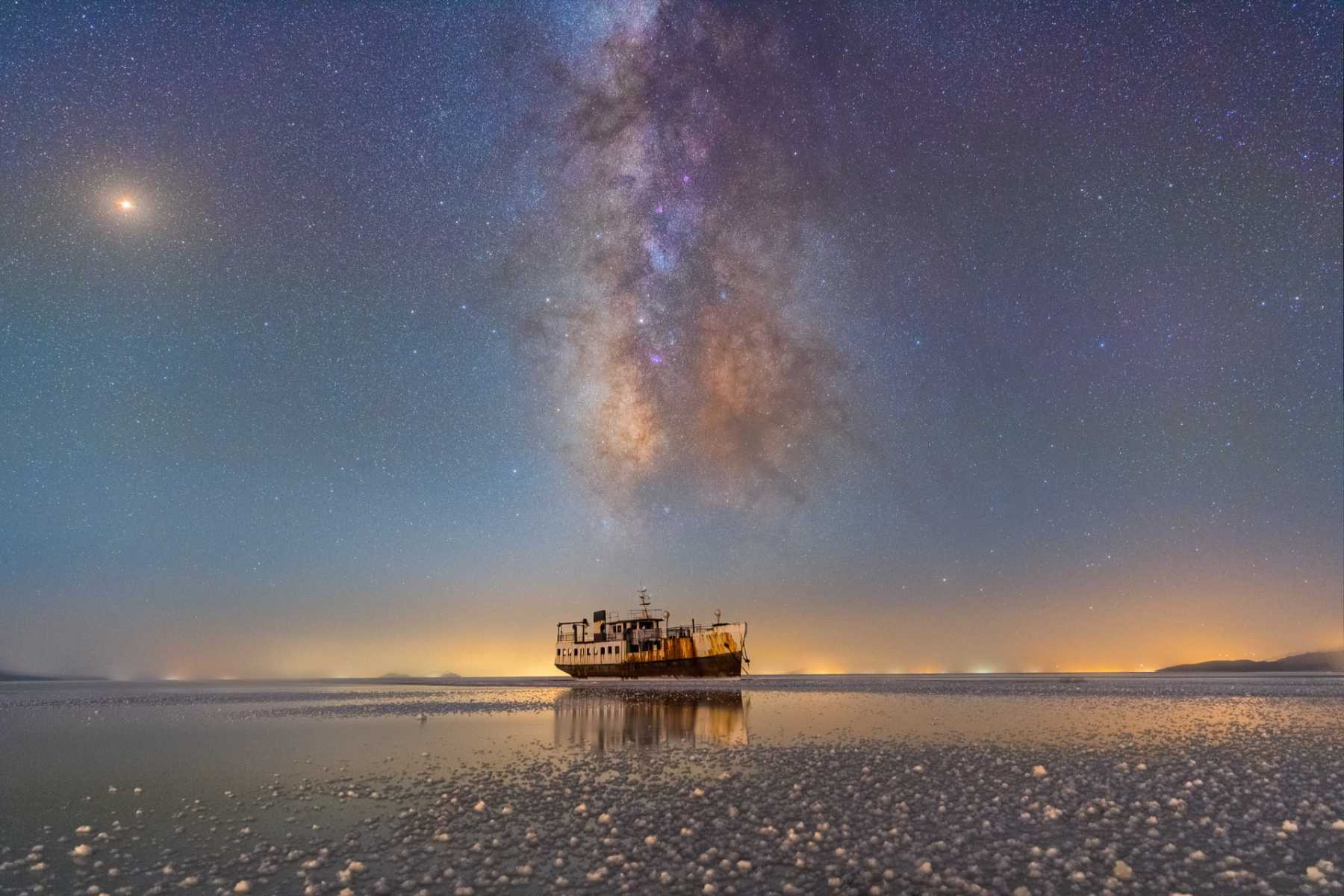 Milky Way and light pollution in the horizon by Masoud Ghadiri