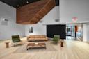 Modern lounge with a tan leather sofa, two green armchairs, a wooden coffee table, and small stools on a light wood floor. The room features high ceilings, white walls, and geometric wooden ceiling accents.