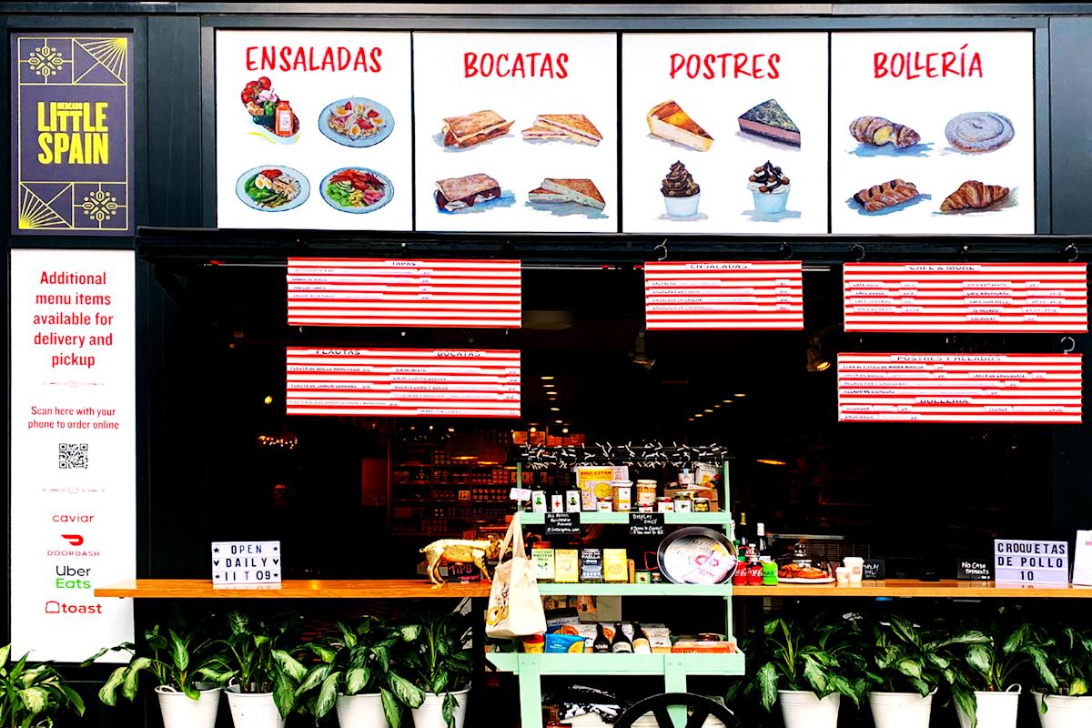 a store front with a display of different types of food.