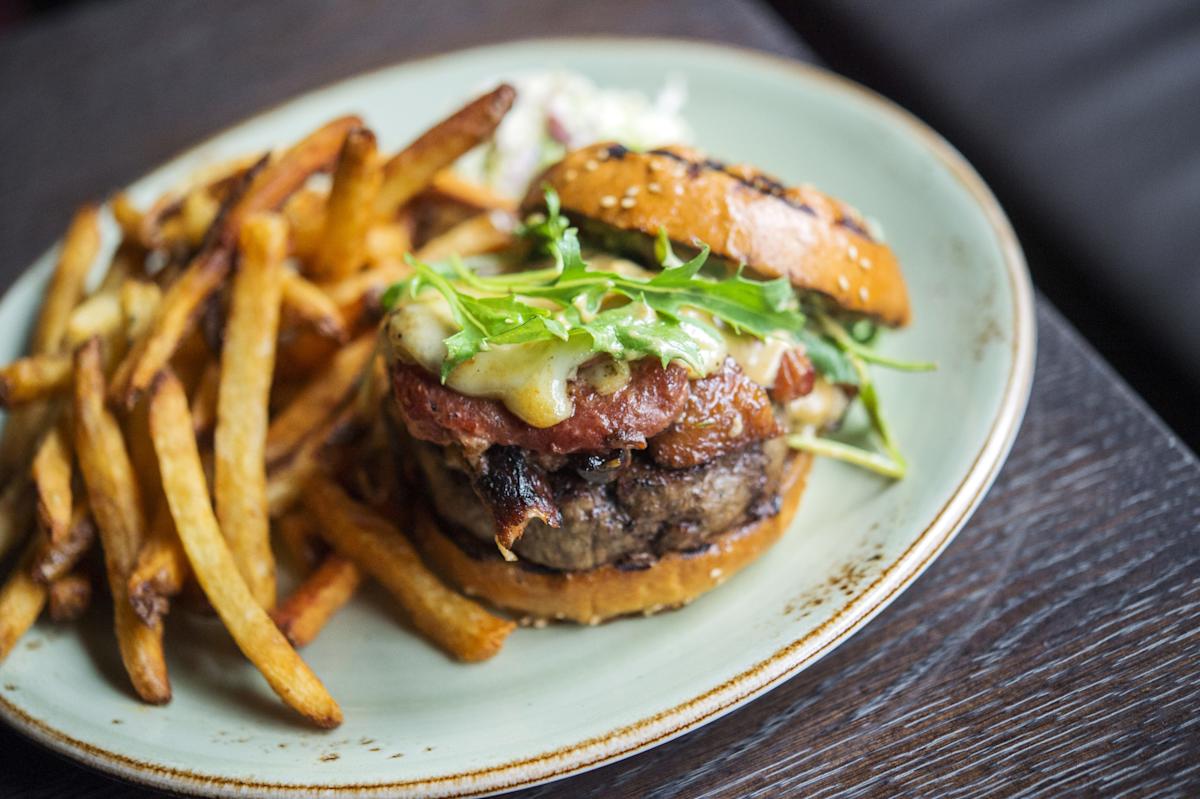 Burger and fries at The Cecil Restaurant in Harlem, NYC