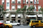 Cars and people waking on Madison Avenue