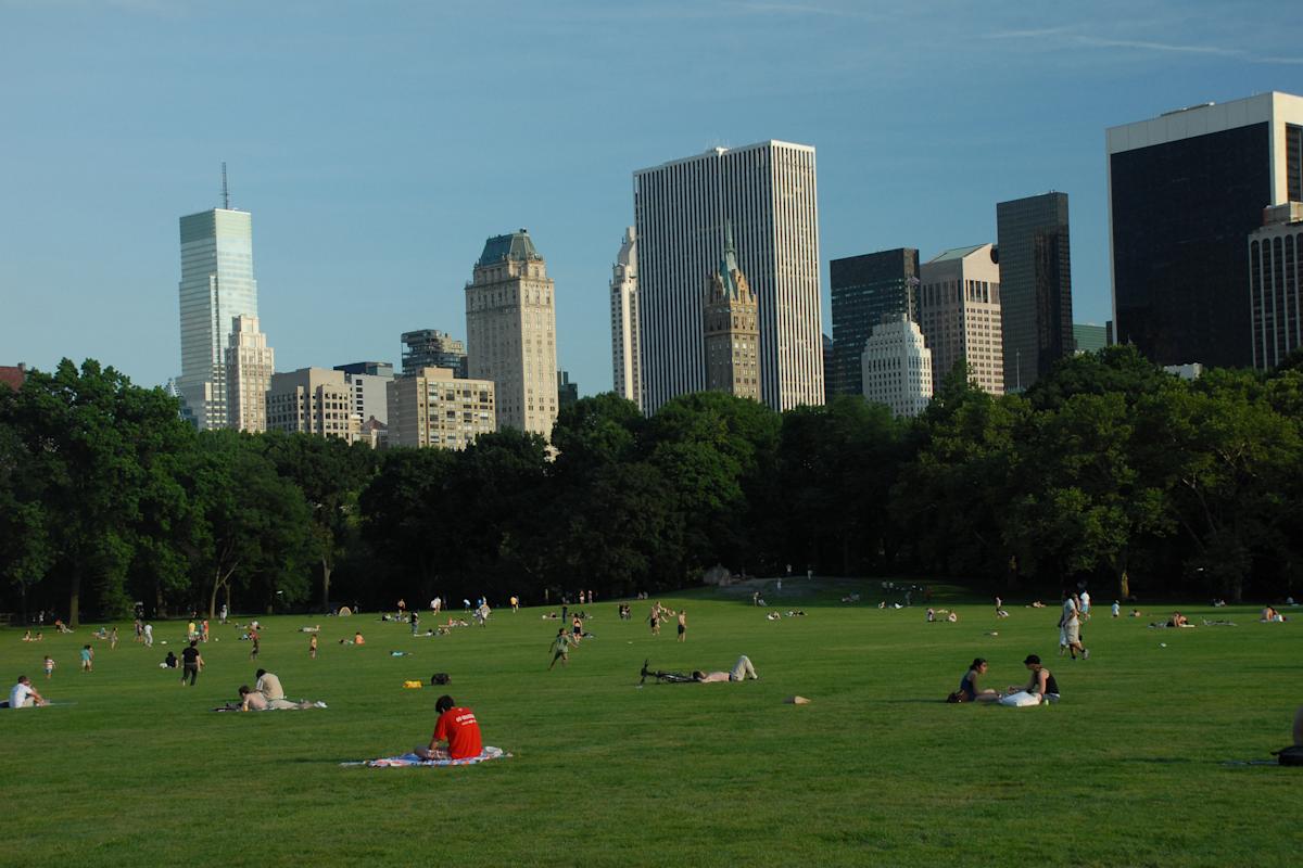 People enjoying the sun at Great Lawn in Central Park, NYC