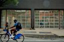 A person bikes in front of Gagosian in Chelsea 