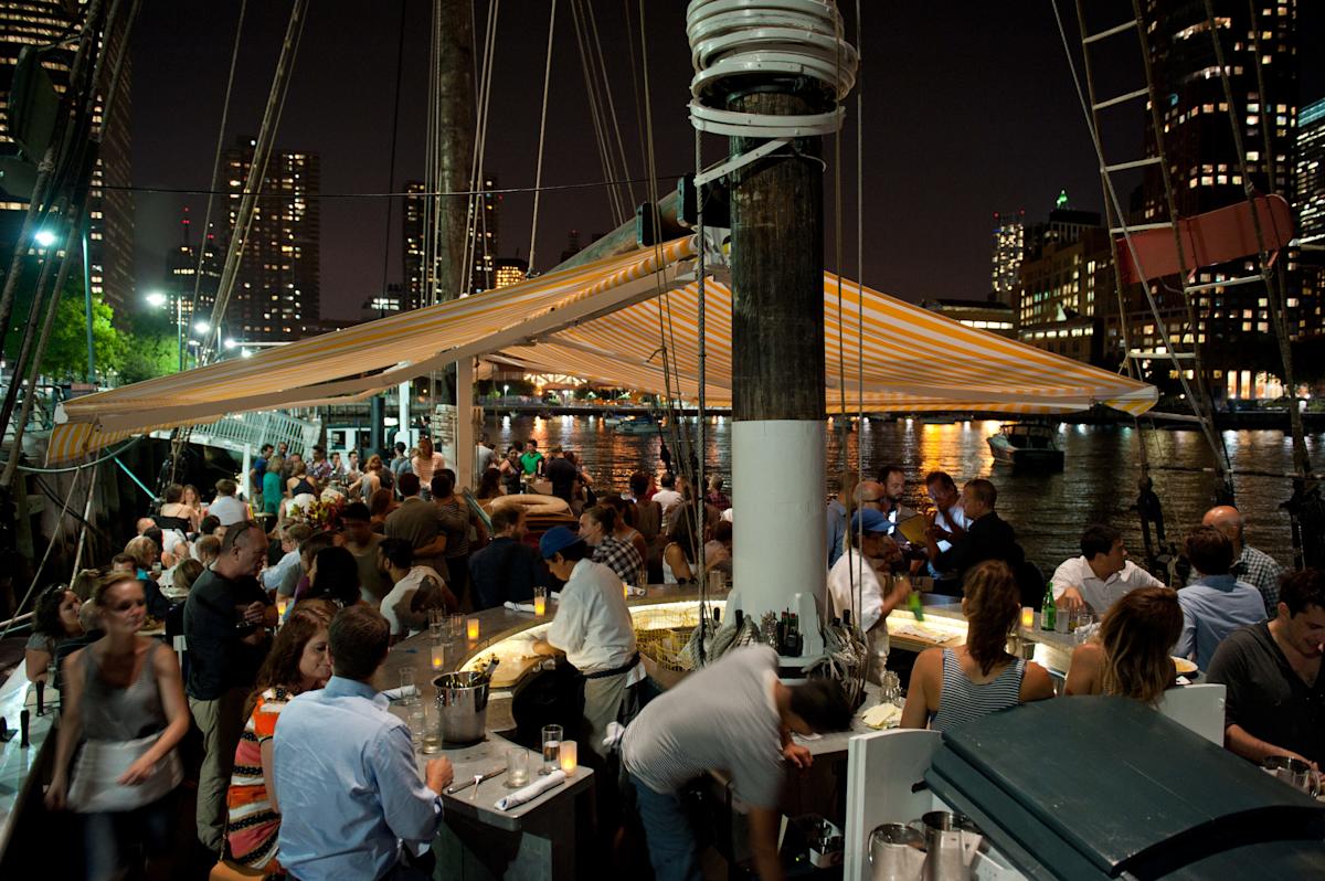 People dining in the evening at Grand Banks in TriBeCa, NYC