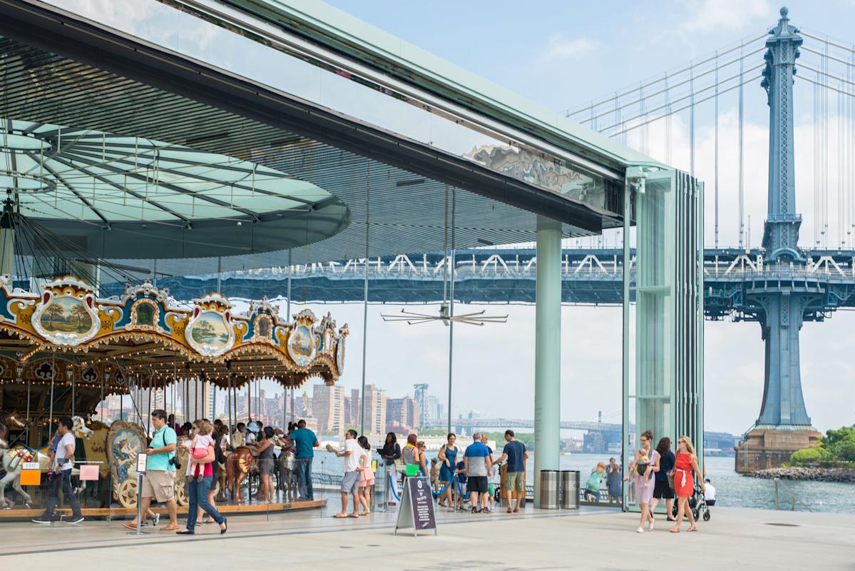 People riding Jane's Carousel in DUMBO, NYC