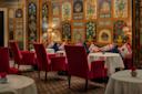 Dining Room with red chairs at The Carlyle, A Rosewood Hotel