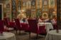 Dining Room with red chairs at The Carlyle, A Rosewood Hotel