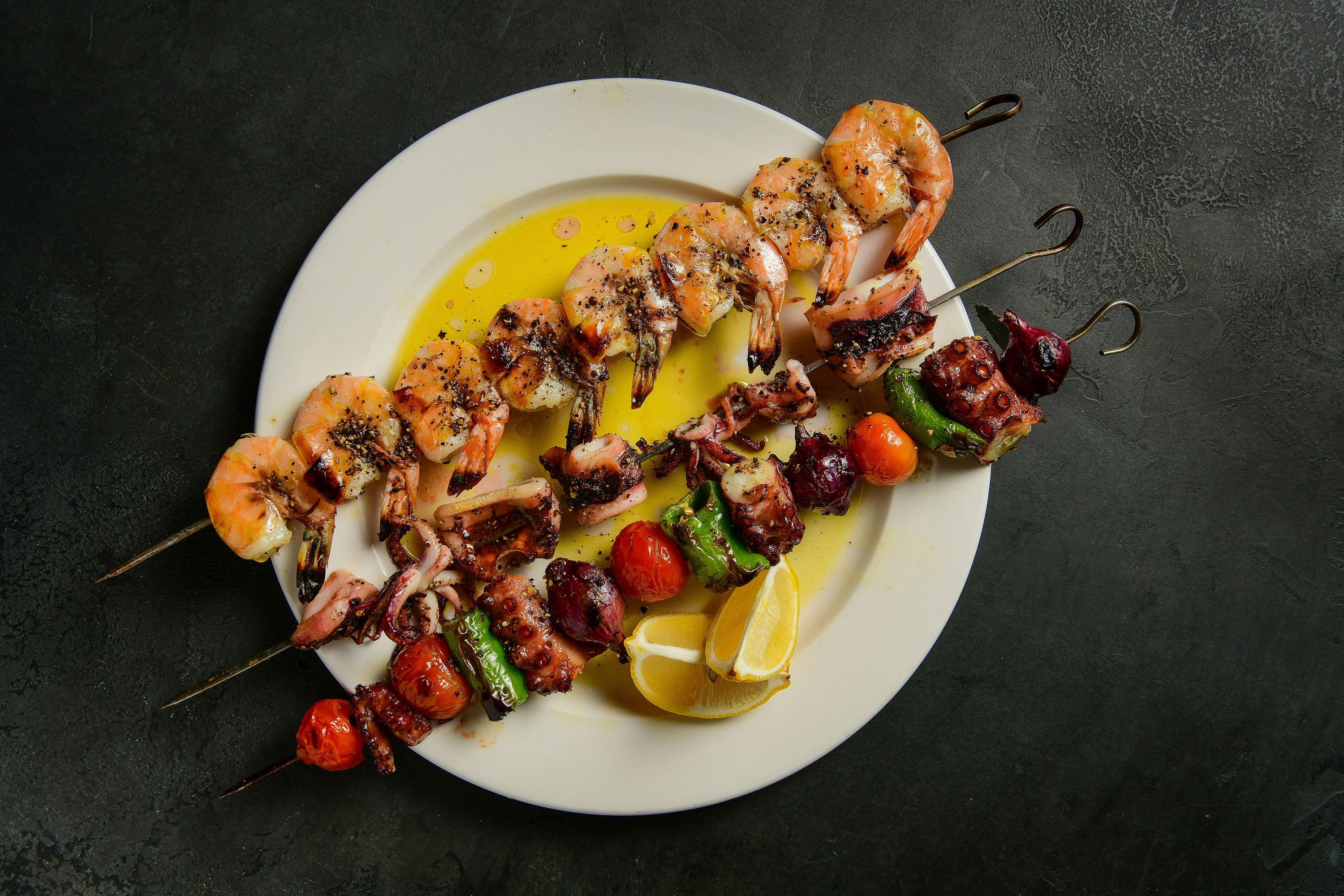 naked-tomato-_-skewers-2-_-octupis-shishlik-wild-ecuadorian-shrimp-calamari-on-skewer-_-vertical-_-max-flatow_c7bca153-3177-4b25-b1d2242ba0240ac5_b6df5a5f-a6c8-4194-9f9114dfa85eb1df