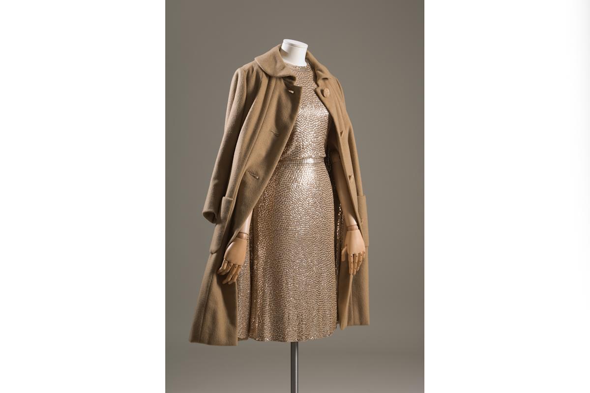 "Gold evening coat and dress in cashmere, silk jersey and sequins" (1958), by Traina-Norell. Courtesy, The
Museum at FIT, Gift of Lauren Bacall.
