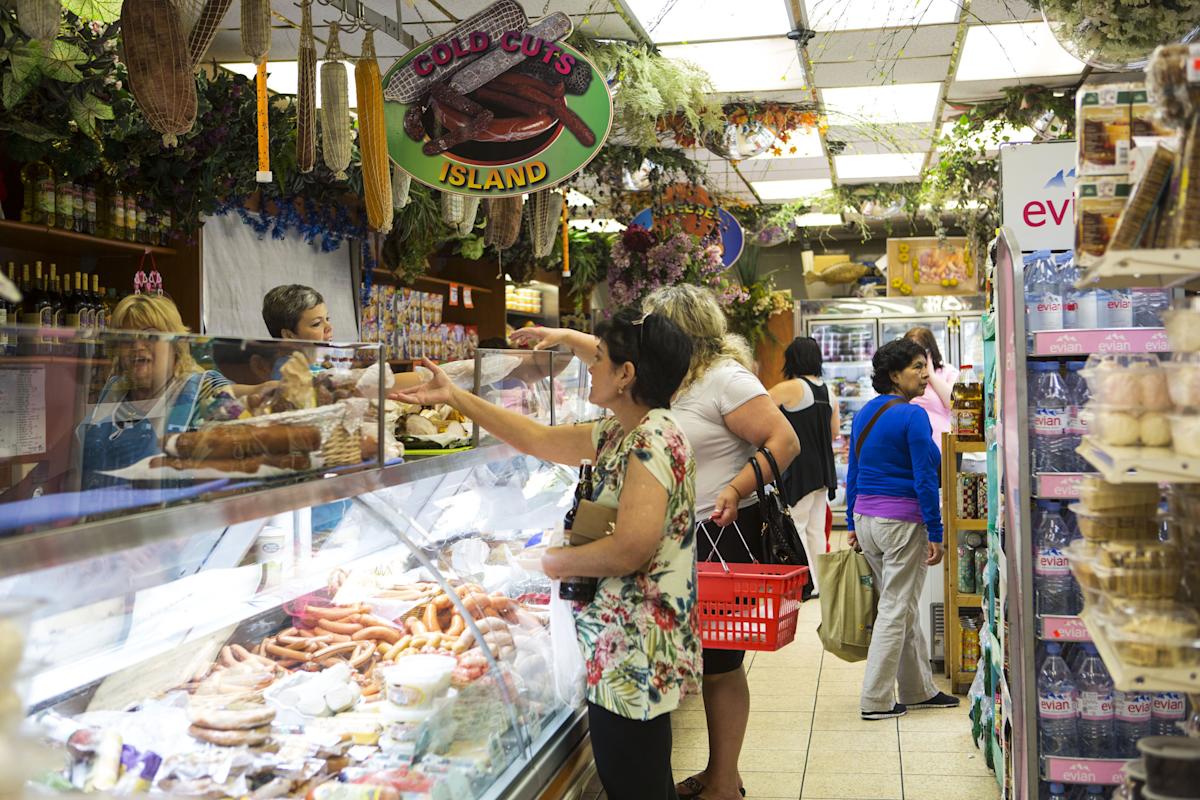 shoppers inside Gold Label International Food in Brighton Beach