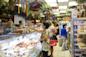 shoppers inside Gold Label International Food in Brighton Beach