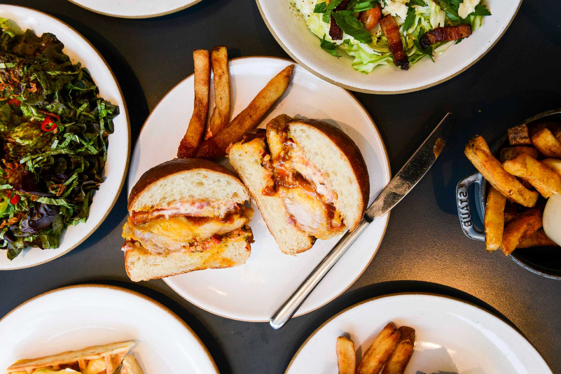 loringplace_greenwichplace_manhattan_nyc_crispy-chicken-sandwich-cut-and-market-lettuces-and-fries_loring-place_liz-barclay.jpg