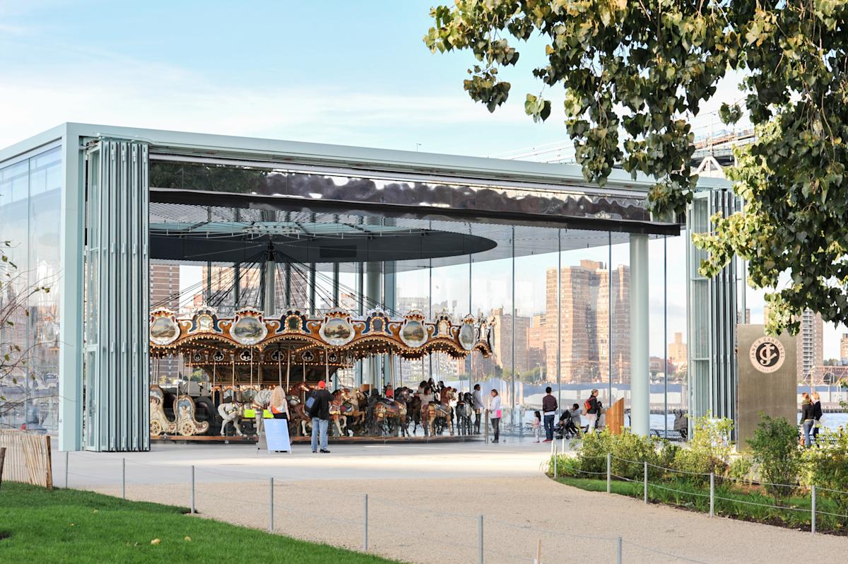 People riding Jane's Carousel in DUMBO, NYC