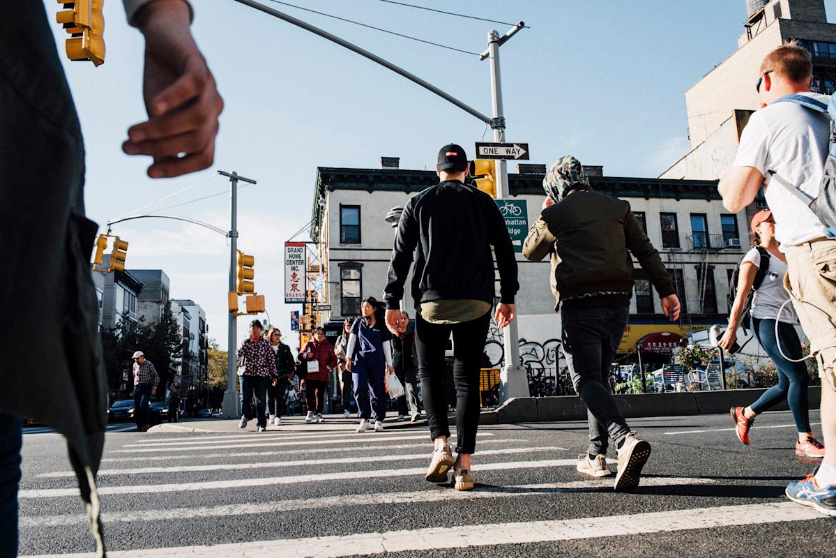People walking across the street in Lower East Side, Manhattan
