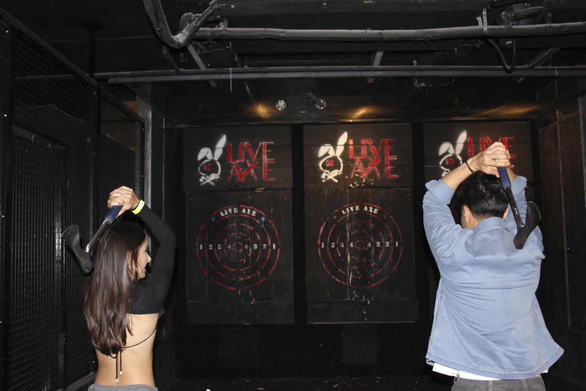 People throwing axes inside Live Axe