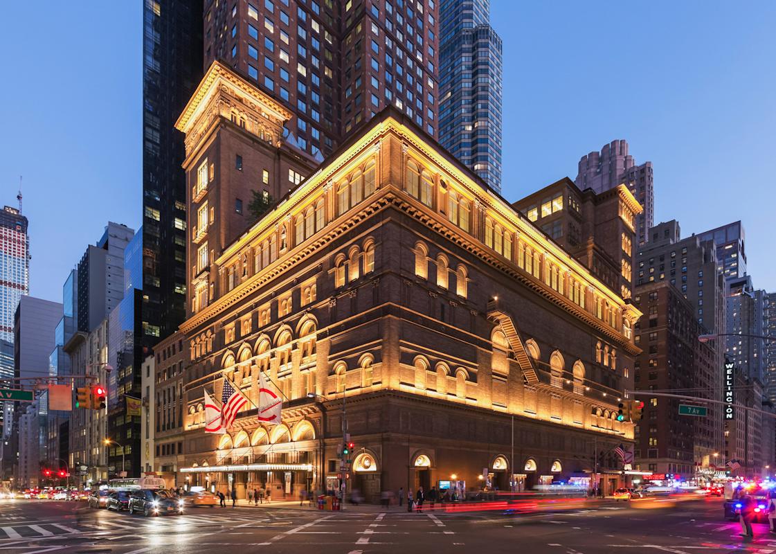 Exterior of Carnegie hall at night in Midtown Manhattan