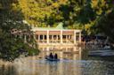 People boating in pond outside the Central Park Boathouse in NYC