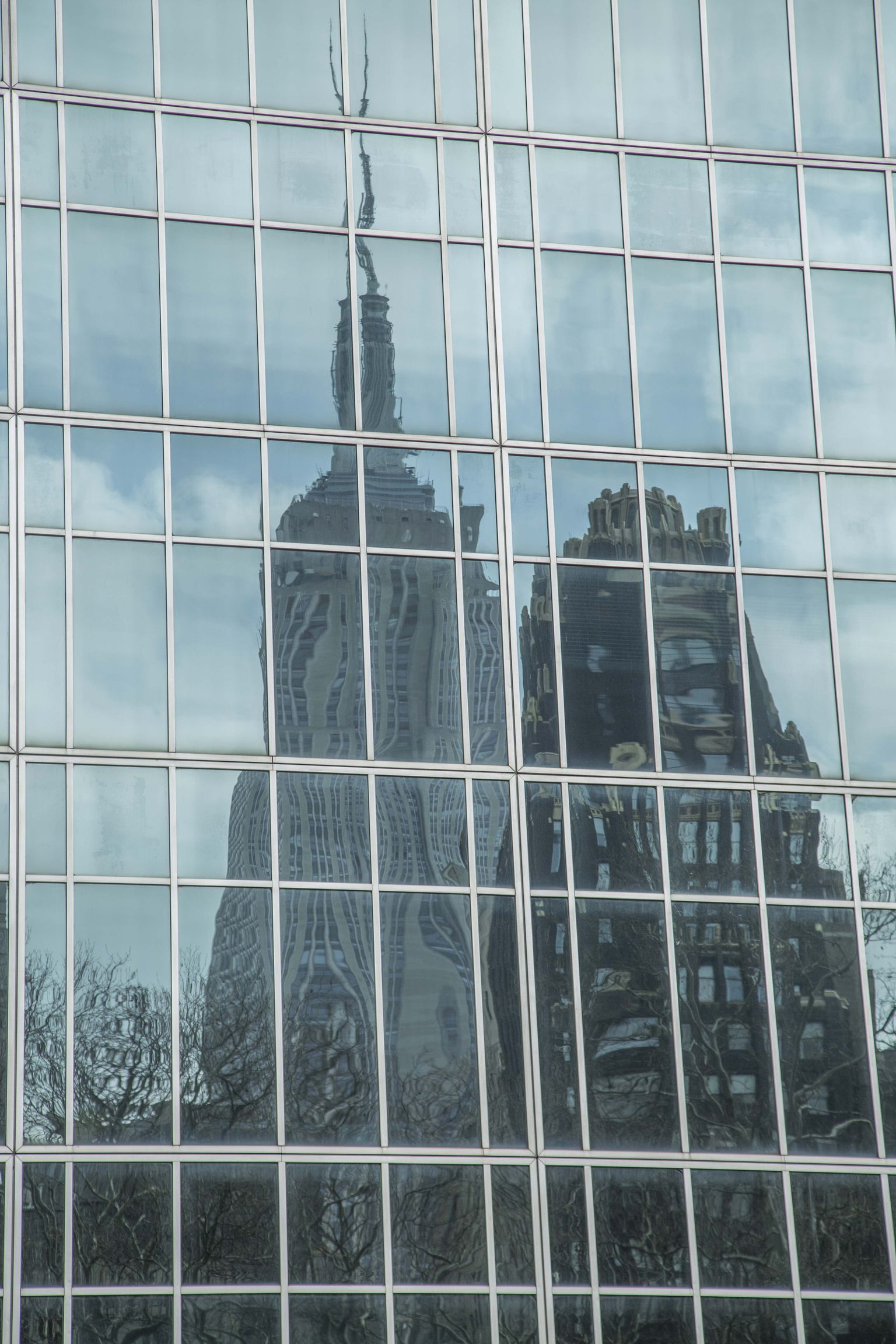 reflection-of-empire-state-building-photo_18118899-1536tall