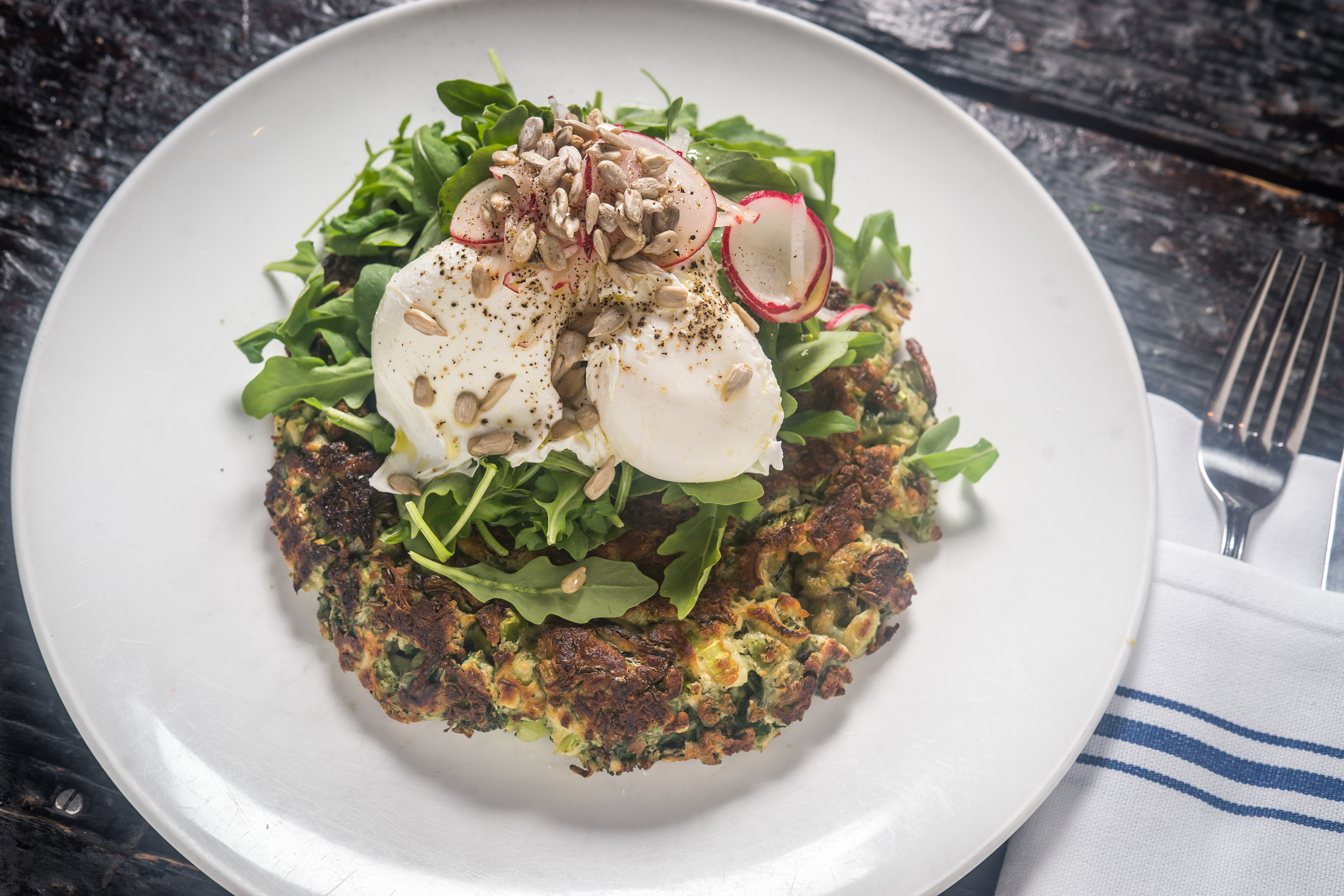 tinys_tribeca_manhattan_nyc_paulwagtouicz_superfood-pancake,-kale,-broccoli,-celery,-ginger,-arugula,-sunflower-seeds,-pochaed-eggs-credit-paulwagtouicz
