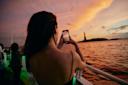 Person taking picture of Statue of Liberty from NYC Water Cruise