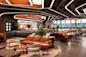 Modern hotel lobby with stylish seating, contemporary lighting design on the ceiling, a bar with a well-stocked backlit shelf, and large windows letting in natural light. The decor features wood accents, plants, and vibrant flowers.