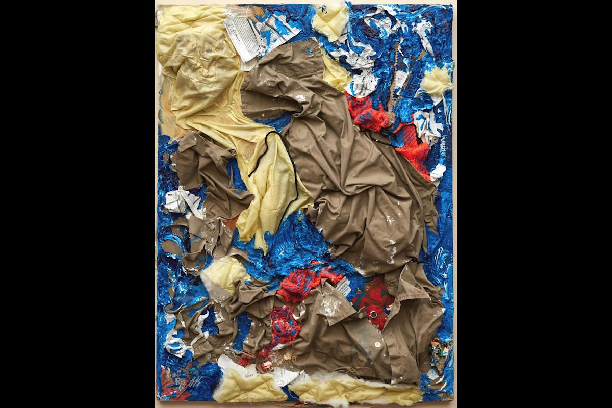 Gilberto Rivera, An Institutional Nightmare, 2012. Federal prison uniform, commissary papers, floor wax, prison reports, newspaper, acrylic paint on canvas. 32.25x24.25 in. Collection Jesse Krimes.