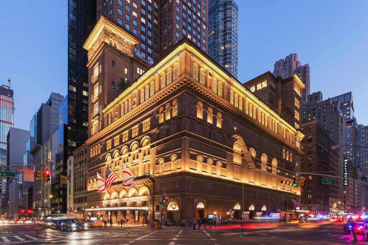 Exterior of Carnegie hall at night in Midtown Manhattan